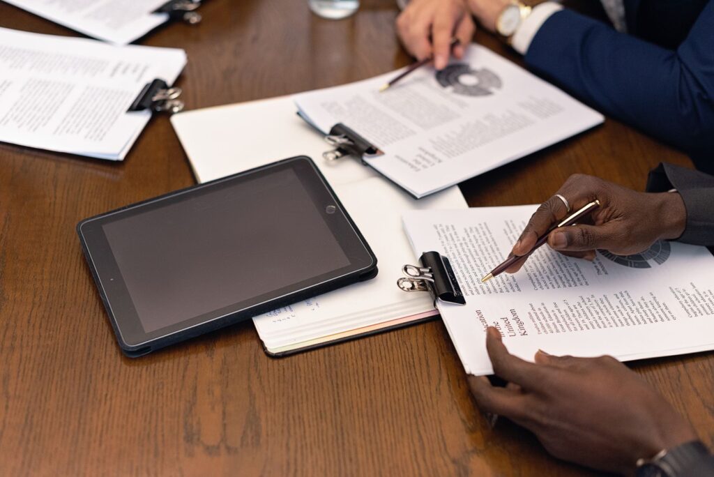Professional with a tablet and documents
