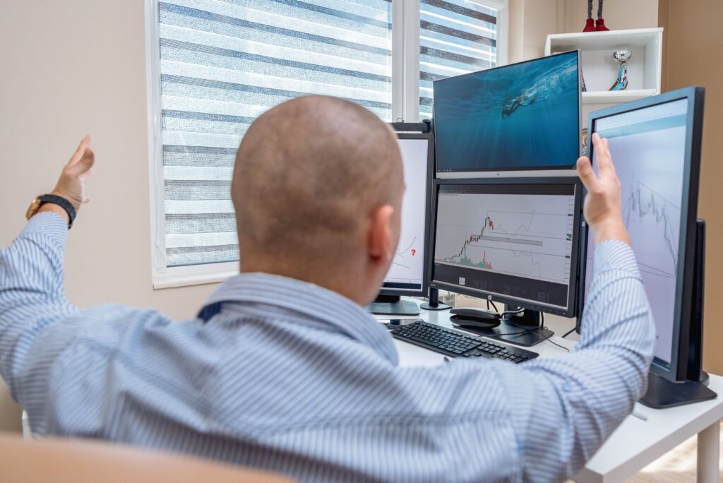 Analyst in front of multiple screens