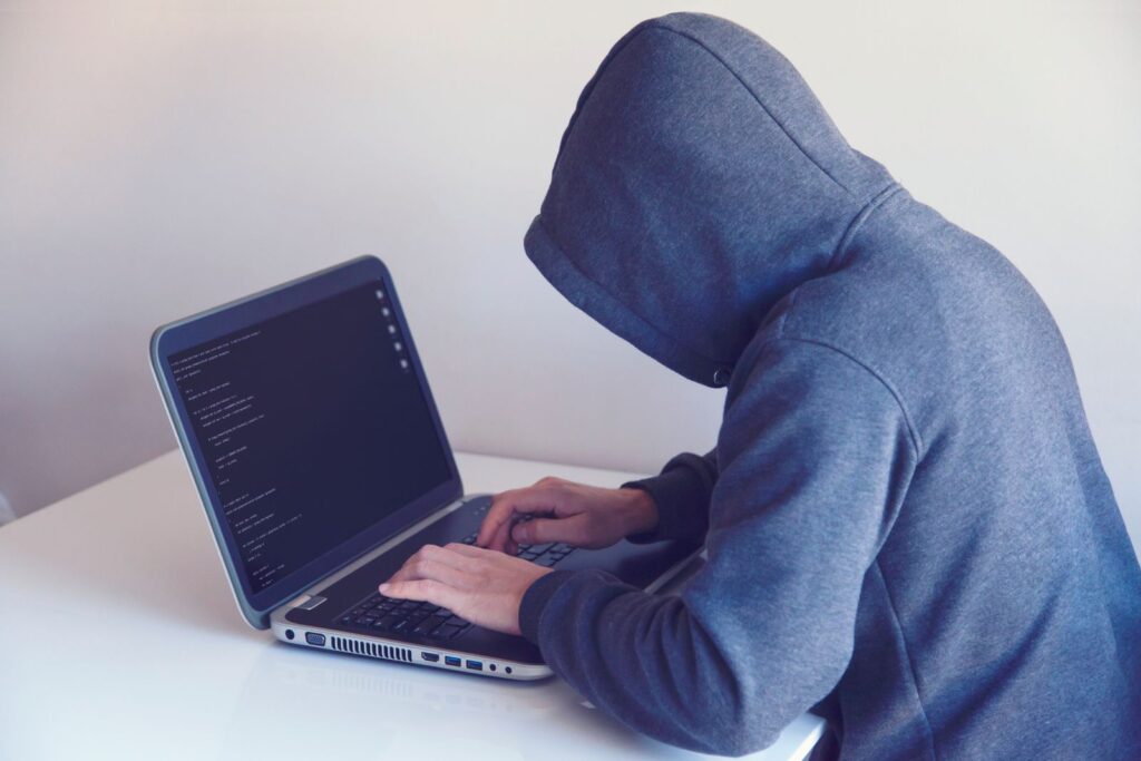 Ethical hacker at a laptop