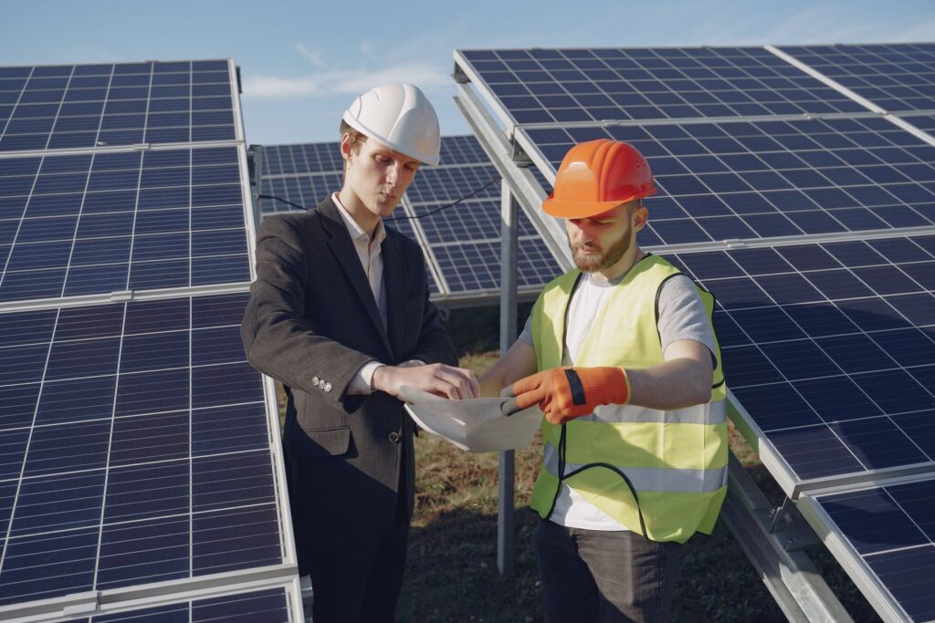 Engineers at solar panels